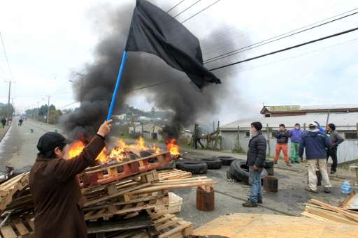 Chilean fishermen protest against government next to a barricade in Ancud, Chiloe island, about 1.230 km southern Santiago, on M