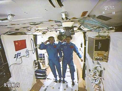 Chinese astronauts enter space station following docking