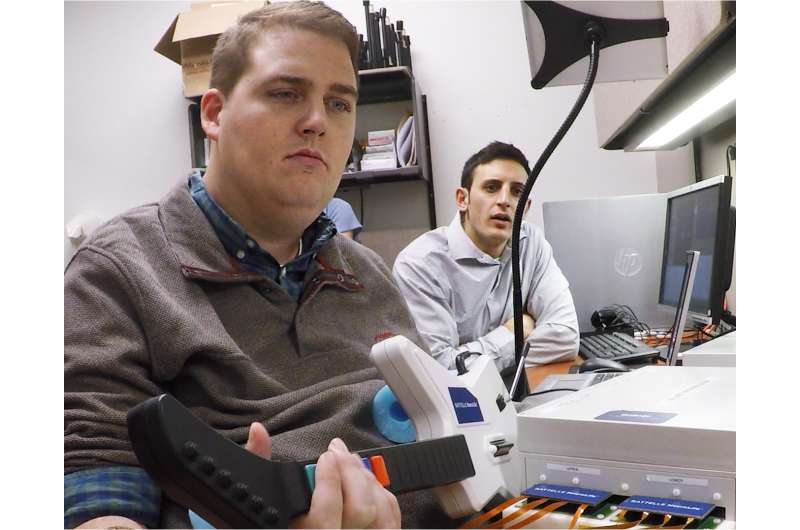 Device allows paralyzed man to swipe credit card, perform other movements