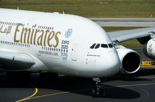 Dubai's Emirates Airline, the largest Middle East carrier, said it will comply &quot;immediately&quot; with the instruction to b