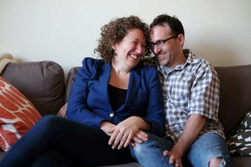 Emily Helfgot and her husband Robert Weinstein, who met each other through an online dating website, pose in their apartment in 