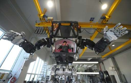 Engineers test a four-metre-tall robot dubbed Method-2 at a lab in Gunpo, on December 27, 2016