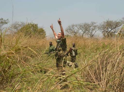 French Garamba National Park security advisor Peter Philippot coordinates a helicopter evacuation for a team of rangers to be re