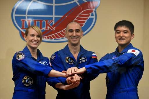 (From L) Members of the main crew of the International Space Station Expedition 48/49, astronauts Kate Rubins, Anatoly Ivanishin