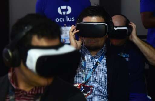 Gaming fans sample Samsung's Gear VR powered by Oculus during the 2016 Electronic Entertainment Expo (E3) annual video game conf