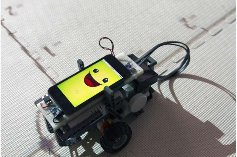 Grade-school students teach a robot to help themselves learn geometry
