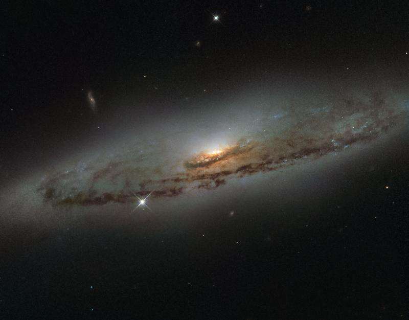 Hubble sees a supermassive and super-hungry galaxy