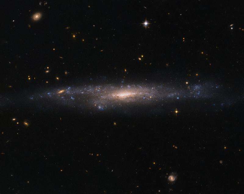Hubble sees galaxy hiding in the night sky