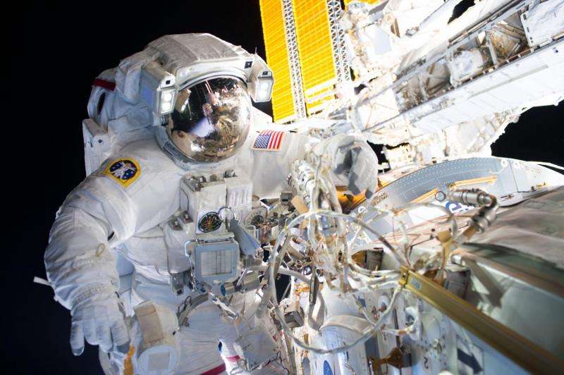 Image: Spacewalkers successfully install new docking adapter for commercial crew flights