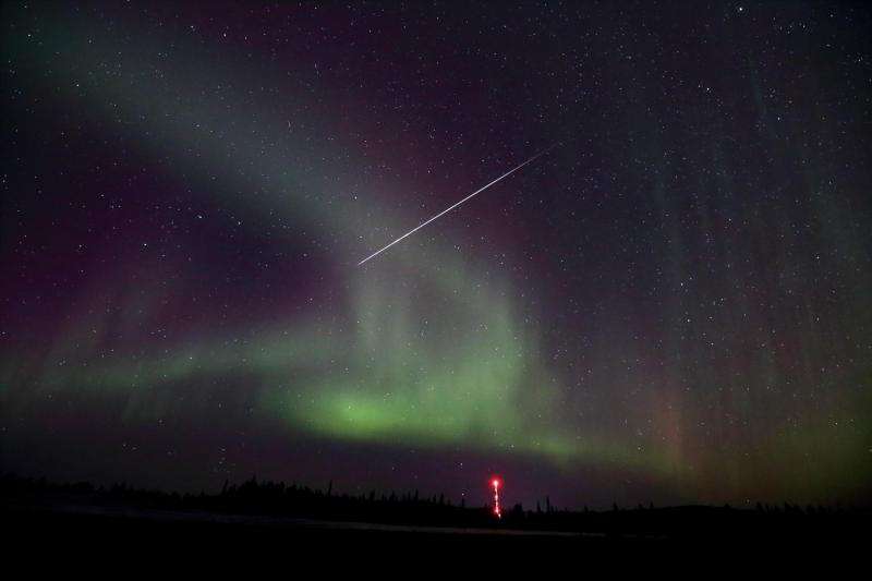 Image: Taurid meteor captured against Northern lights