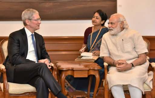 Indian Prime Minister Narendra Modi(R) meets with Apple CEO Tim Cook during a meeting in New Delhi on May 21, 2016