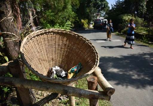 In Mawlynnong, bamboo dustbins stand at every corner, volunteers sweep the streets at regular intervals and large signs order vi