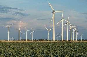 Large-scale wind energy slows down winds and reduces turbine efficiencies