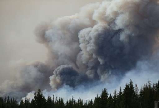 Massive forest fires in western Canada have &quot;injected an enormous quantity of dust into the atmosphere,&quot; which has now