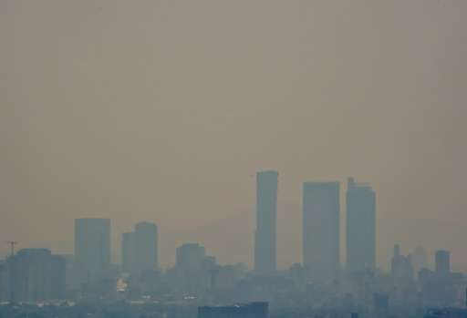 Mexico City authorities issued the first air pollution alert in 14 years due to high ozone levels, restricting traffic, encourag