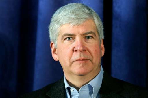 Michigan Governor Rick Snyder attends a press conference at the General Motors Flint Assembly Plant on January 24, 2011 in Flint