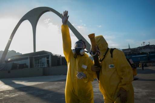 Municipal agents prepare to spray anti-Zika mosquitos chemical product at the sambadrome in Rio de Janeiro