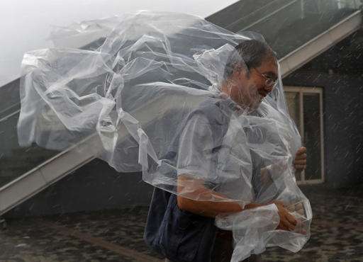 Over 50,000 evacuated in typhoon's path in southern China