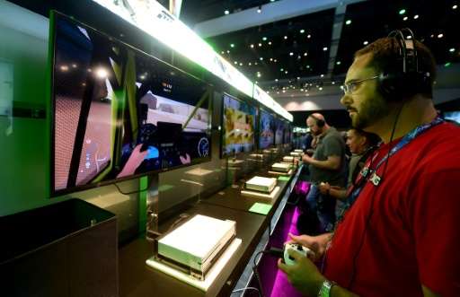 People play 'Forza Horizon 3' during the 2016 Electronic Entertainment Expo (E3) annual video game conference and show in Los An