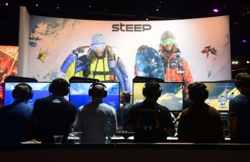 People play 'Steep' by Ubisoft during the Electronic Entertainment Expo (E3) annual video game conference and show on June 14, 2