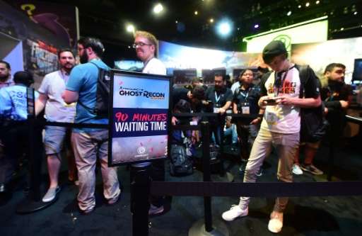 People wait in line to sample Tom Clancy's 'Ghost Recon Wildlands' by Ubisoft on June 14, 2016