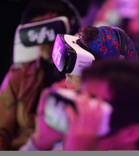 People watch the virtual reality presentation of the SyFi network show, &quot;The Expanse&quot; at the Consumer Electronics Show