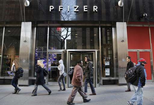 Pfizer beats Street 2Q forecasts despite big drop in profit