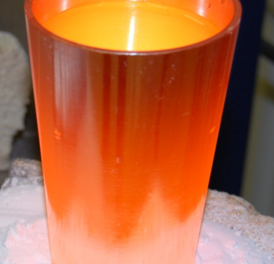 Photograph of hot glass in a platinum crucible immediately after synthesis