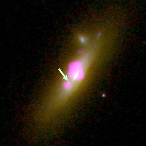Rare galaxy with 2 black holes has 1 starved of stars