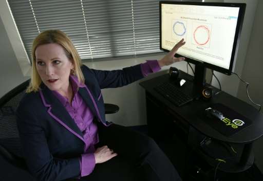 RightEye President demonstrates her company's eye-tracking technology at offices in Bethesda, Maryland