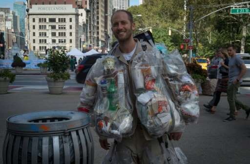 Rob Greenfield, an environmental activist who is spending a month in New York, has hanging on himself all the trash he's produce