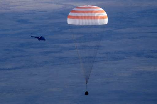 Russia's Soyuz MS space capsule, carrying the ISS crew, astronauts Kate Rubins, Anatoly Ivanishin and Takuya Onishi, lands in a 