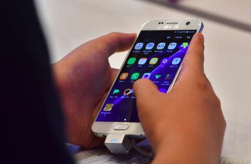 Samsung said its key mobile division enjoyed &quot;substantial earnings improvement&quot; led by expanded sales of its high-end 