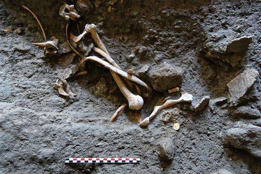 Skeletons, coins found in dig of ancient Pompeii shop