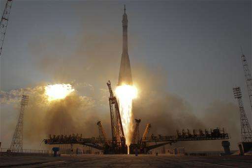 Soyuz capsule docks with International Space Station