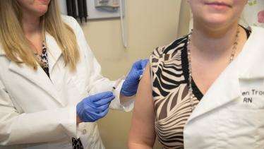 State laws boost flu vaccination rates in health care workers
