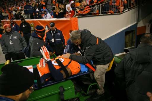 Strong safety David Bruton of the Denver Broncos is carted off the field after suffering a reported concussion