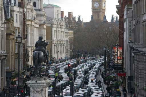 Taxi drivers block Whitehall as they demonstrate in central London on February 10, 2016