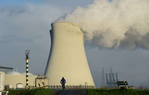 The cooling towers of Belgium's Doel nuclear plant belch thick white steam on January 12, 2016