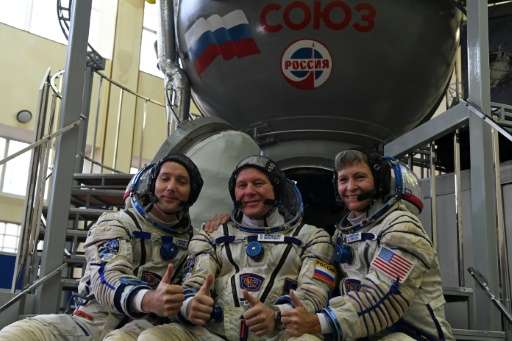 The crew heading to the ISS is composed of NASA astronaut Peggy Whitson (R), French astronaut Thomas Pesquet (L) and Russian cos