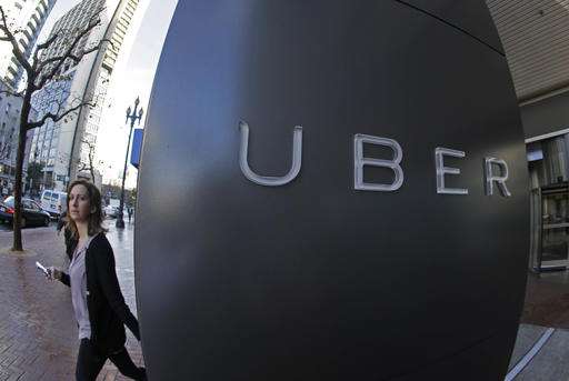 UK Uber drivers win case to get paid vacation, minimum wage