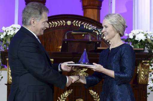 US biochemical engineer Frances Arnold (R) receives her Millennium Technology Prize 2016 from Finnish President Sauli Niinisto i