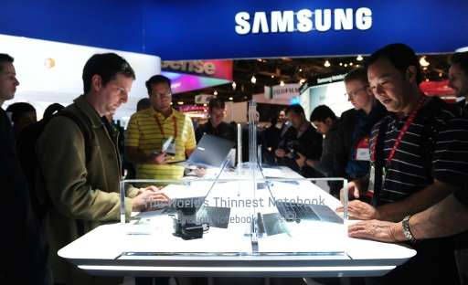 Visitors check out Samsung's laptop computers during the International Consumer Electronics Show in Las Vegas, Nevada