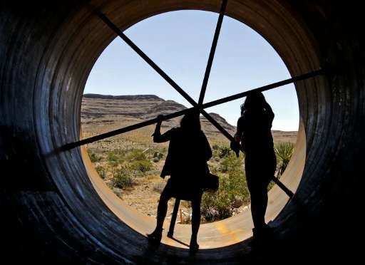 Visitors get a chance to inspect the inside of a Hyperloop tube during the first open air propulsion test at the Hyperloop One T
