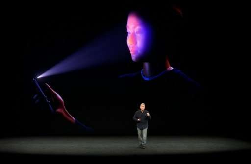 Apple senior vice president Philip Schiller shows the FaceID system which is being used on new iPhone X, allowing a user to unlo