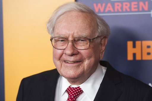 Buffett cuts stake in IBM and shares slide