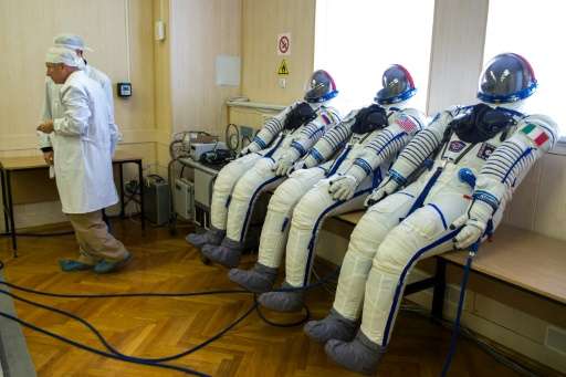 The astronauts' space suits are tested before the launch