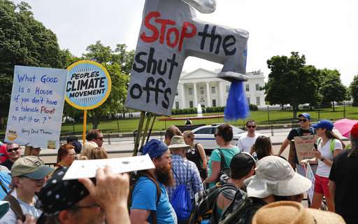 Thousands brave weather to protest Trump climate policies