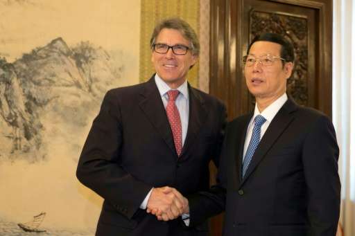 US Energy Secretary Rick Perry (left) shakes hands with China's Vice Premier Zhang Gaoli in Beijing on June 8, 2017