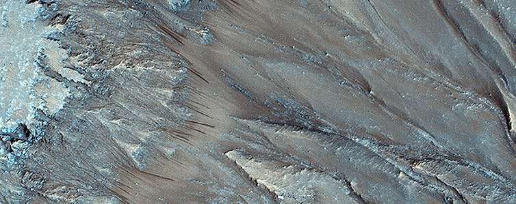 What could explain the mystery of how land formed on Mars without much water